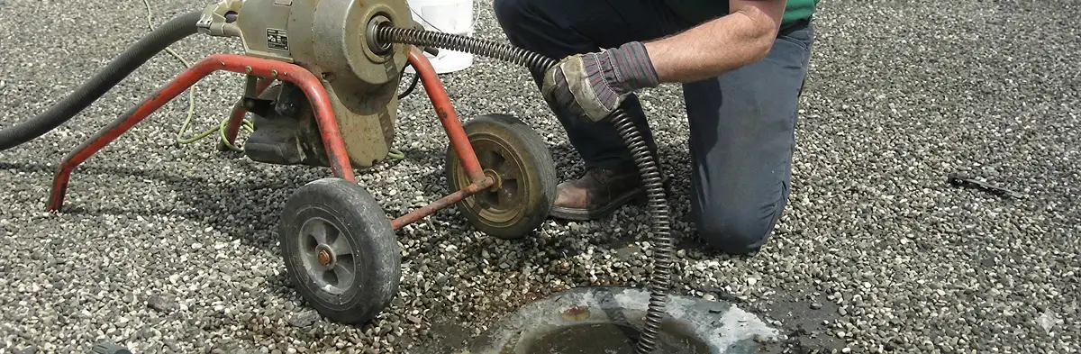 sewer rodding technician actively removing blockages from a sewer line in Spokane, WA