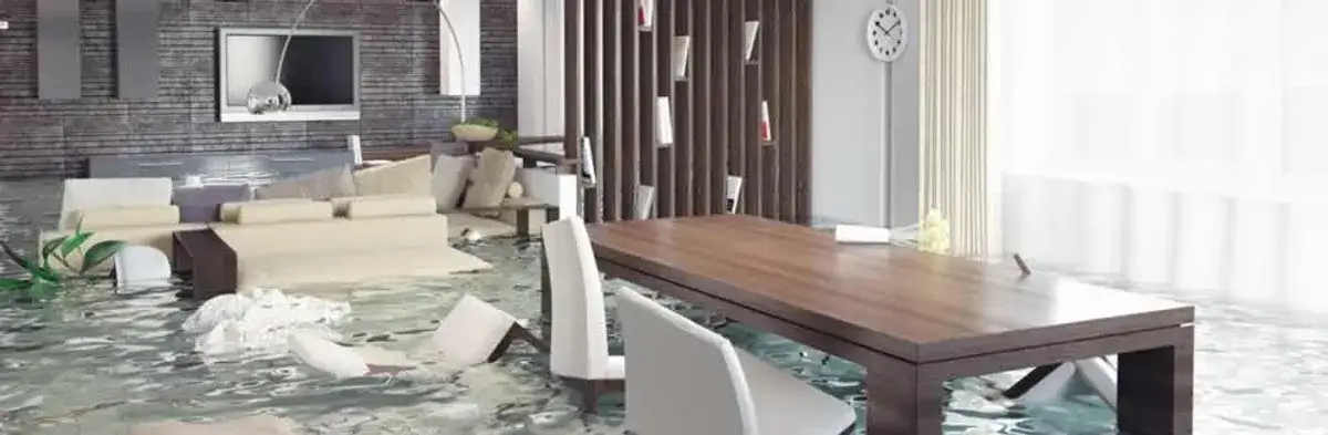 home interior affected by water damage with flooded floors and displaced furniture in Spokane, WA